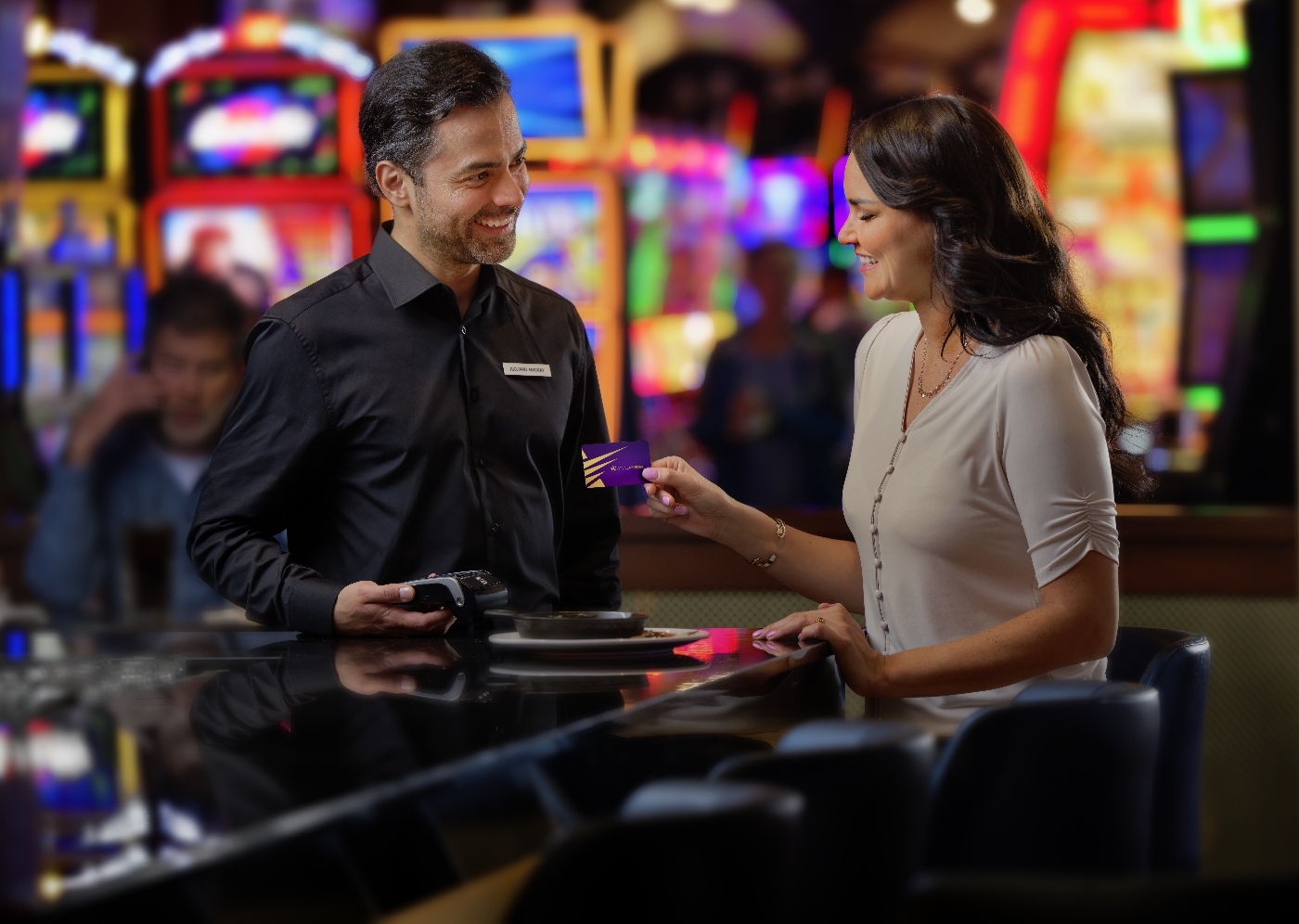 A Winner’s Edge member passes the card to casino staff.