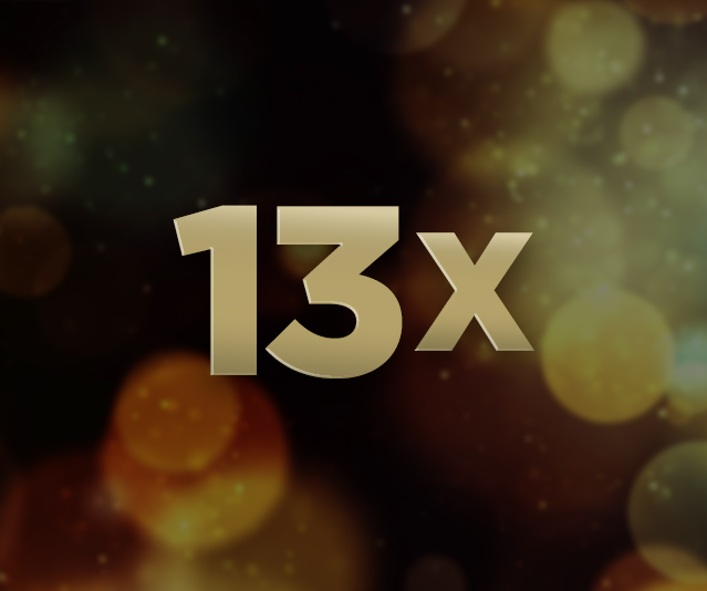 '13X' in the middle with an image of partially blurred gold lights in the background