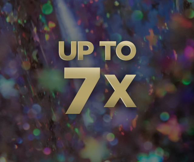 'Up to 7X' in the middle with an abstract design of a mix of blurred, colorful light spots and reflections in the background.